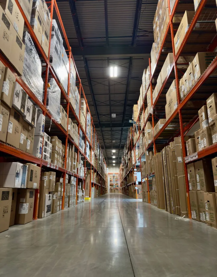 FMCG and food distribution warehouse aisle with stocked pallets