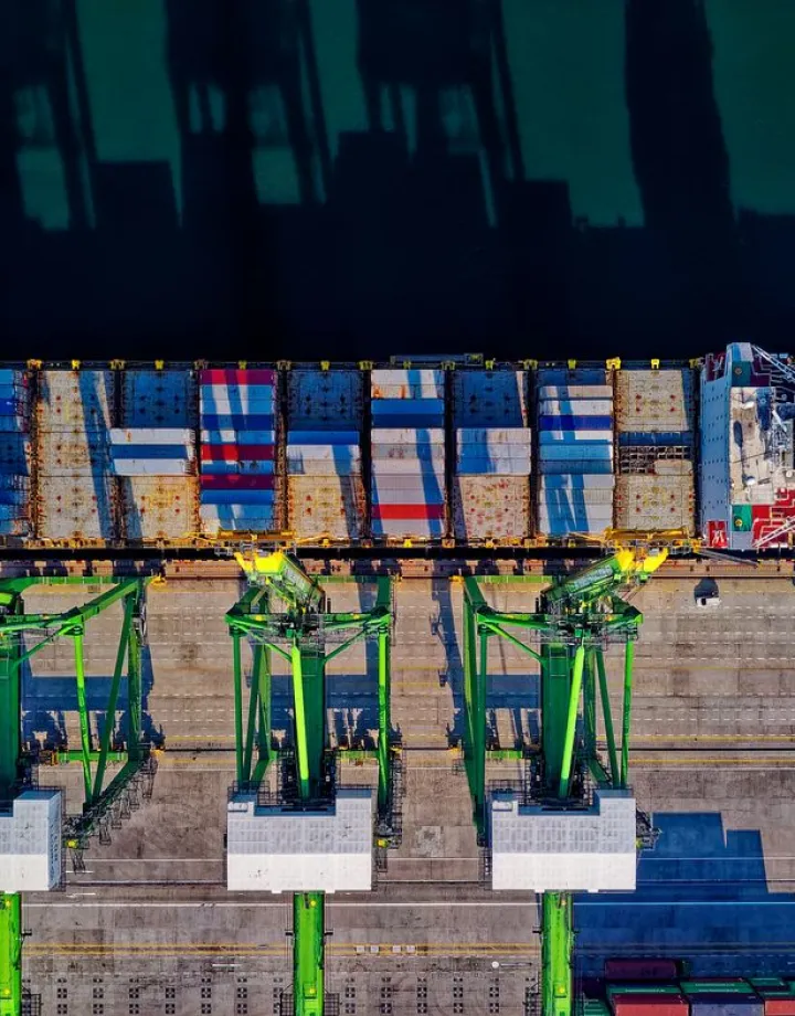 Aerial view of a container ship at port for general trading and import