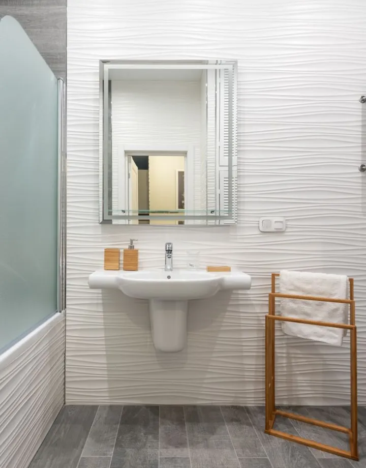 Modern bathroom with tiles and sanitaryware, a trading vertical served by Square Loop ERP